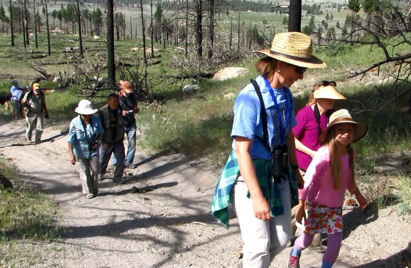 Christy and daughter Delaney on birdwatching walk in burned forest courtesy of Maya Khosla